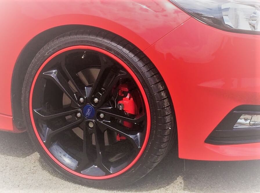 A red Alloygator Wheel on a car