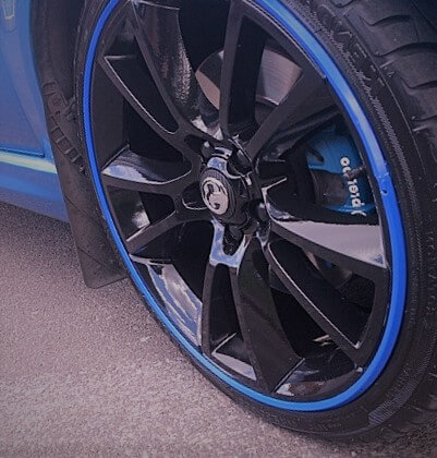 A blue Alloygator Wheel on a car
